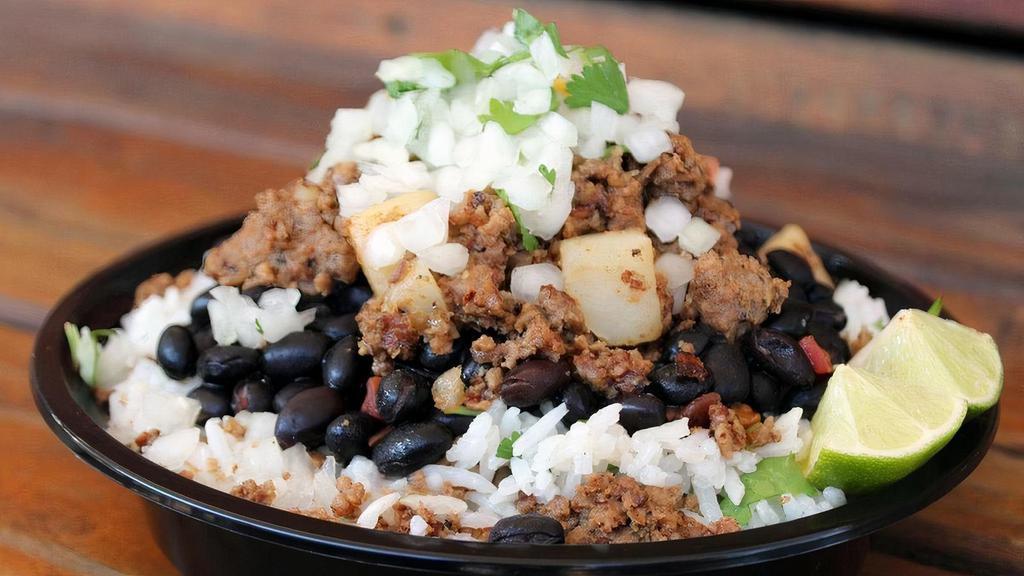 #1 Picadillo Bowl · Topped with spicy ground beef and potatoes, diced onion, cilantro.