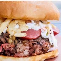 The Herd · The Herd comes with chopped beef, pulled pork, sausage topped with BBQ sauce, coleslaw, hous...