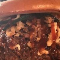 The Backyard · Backyard comes with chopped beef, pulled pork, sauced with coleslaw, house-made pickles and ...