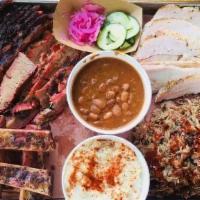 Sampler · All sample of four meats with your choice of two sides and three slices of bread and a 1.5 o...