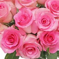 Debi Lilly Dozen Pink Rose Bouquet (Pink) · Dozen Roses wrapped in a kraft wrap.