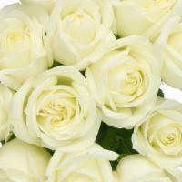 Debi Lilly Dozen White Rose Bouquet (White) · Dozen Roses wrapped in a kraft wrap.