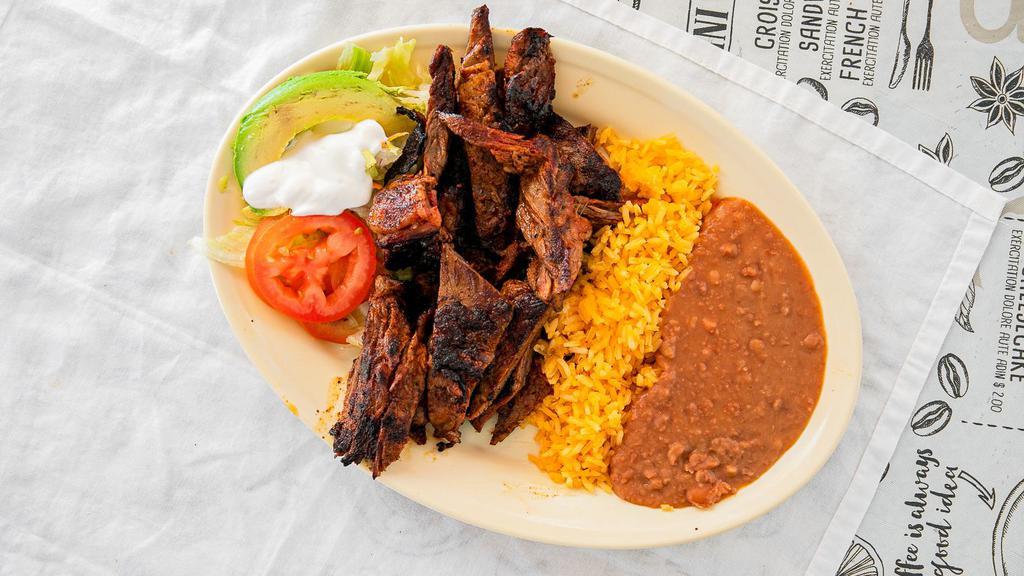 Fajita · Served with rice and beans.