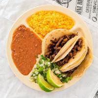 Tacos Special · Three tacos, arroz, frijoles, y refresco en lata.