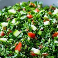 Tabouli · Salad with parsley, burghul, chopped green onions, tomatoes, olive oil & lemon juice.