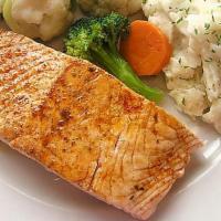 Salmón A La Plancha · Grilled with mashed potatoes and veggies.