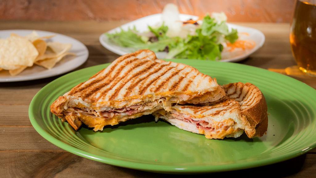 Turkey Bacon Ranch Panini · Sliced turkey breast, smoked bacon, cheddar cheese and our homemade creamy ranch spread on our fresh baked sourdough bread.