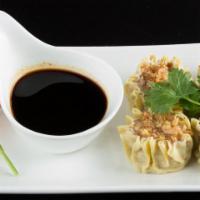 Pork Dumplings (4) · Ground pork and spices in a steamed dumpling, topped with crispy garlic in oil, served with ...