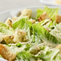 1/2 Caesar Salad · Chopped romaine served with a side of Caesar dressing, grated Parmesan, and croutons.