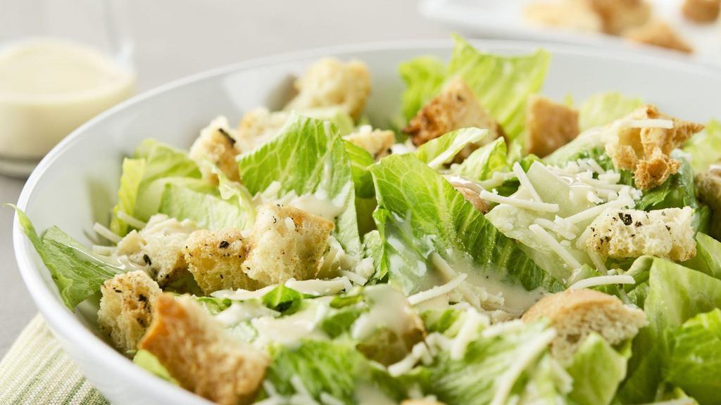 1/2 Caesar Salad · Chopped romaine served with a side of Caesar dressing, grated Parmesan, and croutons.