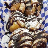 Fried Oreos (6) · Covered with powered sugar and chocolate syrup. Add Ice Cream for $1.00