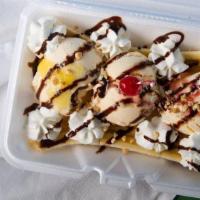 Banana Split “Vanilla Ice Cream” · Three scoops of vanilla ice cream and bananas topped with strawberry, chocolate, pineapple s...