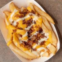Deluxe Bacon, Cheese, & Ranch Fries · Phil's seasoned fries topped with grilled bacon, cheese sauce, and ranch dressing. Available...