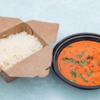 Chicken Tikka Masala · Marinated grilled pieces of chicken in a creamy tomato sauce served with basmati rice.
