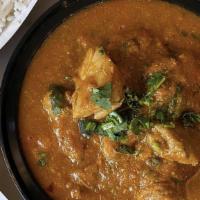 Chicken Curry · Curried onion sauce served with basmati rice.
