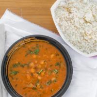 Channa Masala · Vegan. Chickpeas with tomatoes and herbs in a curry served with basmati rice.