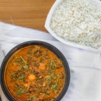 Palak Chicken Curry · Chopped spinach and chicken in a curried sauce served with basmati rice.