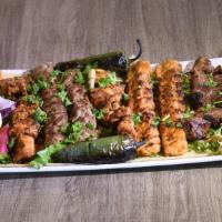 Family Kabob Plate · 8 Skewers of :
2 skewers of beef kabab (kofta), 
2 chicken kabab (kofta), 
2 skewers of  tik...