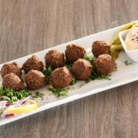 Falafel Plate · 10 Golden Chickpea fritters served  with hummus and your choice of entree side. 
Add extra s...