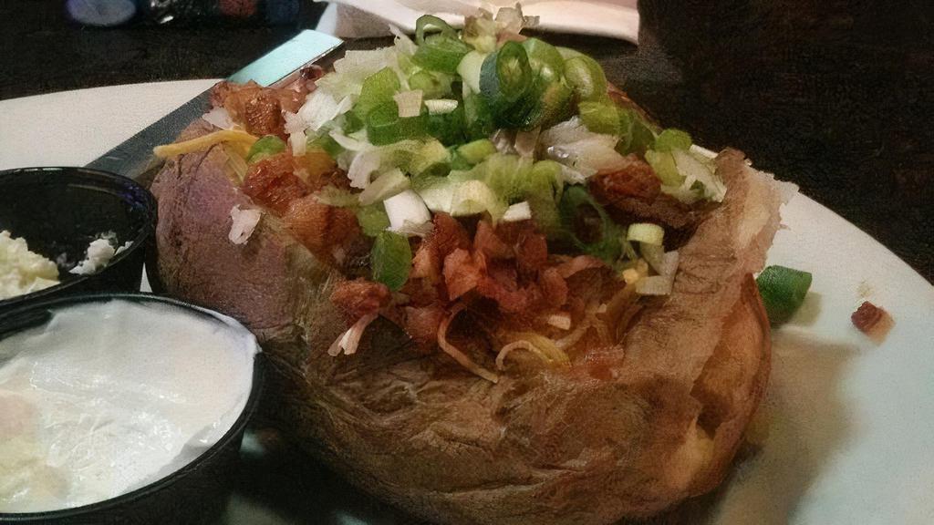 Loaded Baked Potato · Large Potato served w/ Butter, Bacon, Sour Cream, Chives & Mixed Shredded Cheese