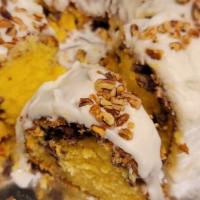 Sock It To Me Cake (Slice) · Moist and buttery cake with a cinnamon brown sugar pecan swirl in the  middle and topped wit...