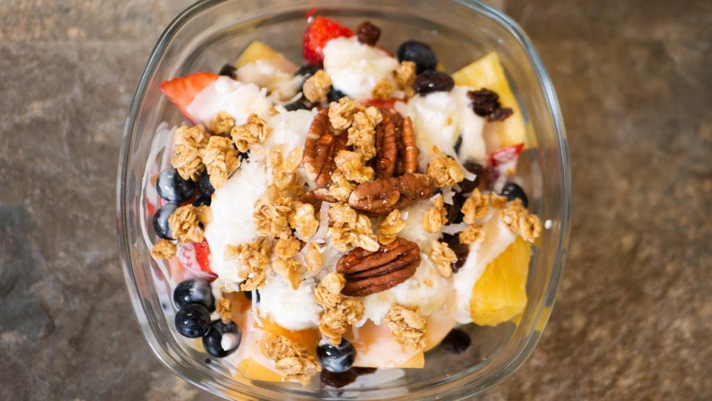 Bionico · Mixed fruit with yogurt, granola, pecans, raisins, coconut flakes, and honey.