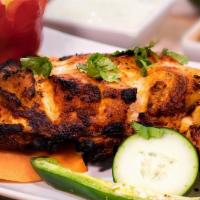 Chicken Tikka Masala · Grilled boneless chicken cubes finished in a creamy flavored tomato sauce.