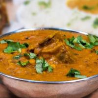 Daal Goat · Goat meat stewed along with lentils, cumin, and fresh spices.