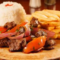 Lomo Saltado  · Tender Steak, fresh onions, tomatoes mixed in a fine blend of spices made fresh when you ord...