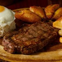 Bistek A Lo Pobre (Specialty Meal) · 10 oz Ribeye Steak, Over Easy Egg, French Fries, Cilantro Rice and Fried Plantains.