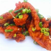 Haus Buffalo Strips · Haus buffalo sauce, scallions; served with choice of dipping sauce.