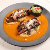 Tlacoyos Adelita W/Arrachera · Grilled outside skirt, 2 bean tlacoyos, salsa roja, cotija + pico, served w/Guac. You can ad...