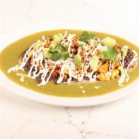 Chorizo + Huevos Huarache · Mexican masa foot long, topped w/refried black beans + topped w/scramble eggs w/chorizo, cre...
