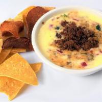 Queso Blanco With Ground Beef Chorizo · Our signature queso blended with ground beef chorizo