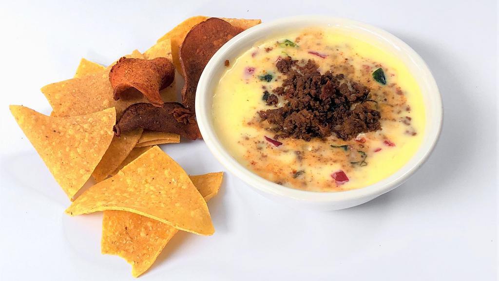 Queso Blanco With Ground Beef Chorizo · Our signature queso blended with ground beef chorizo