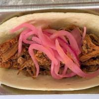 Bbq Pork Tacos · Two pulled smoked pork with a pineapple habanero BBQ sauce topped with pickled red onions. S...