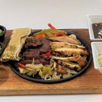 Fajitas · Classic SW Signature with your choice of grilled protein on a bed of sautéed peppers and oni...