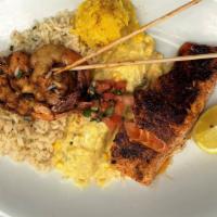 Seafood Mixed Grill · Grilled rojo shrimp, red chile salmon topped with fresh fruit salsa, blue crab shrimp enchil...