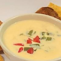 Queso Blanco - Pint · Our signature white queso simmered onion and roasted poblanos