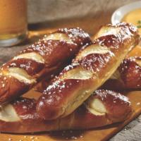 Bavarian Pretzel Sticks · Four Bavarian pretzel sticks served with mustard beer cheese sauce made with Guinness.