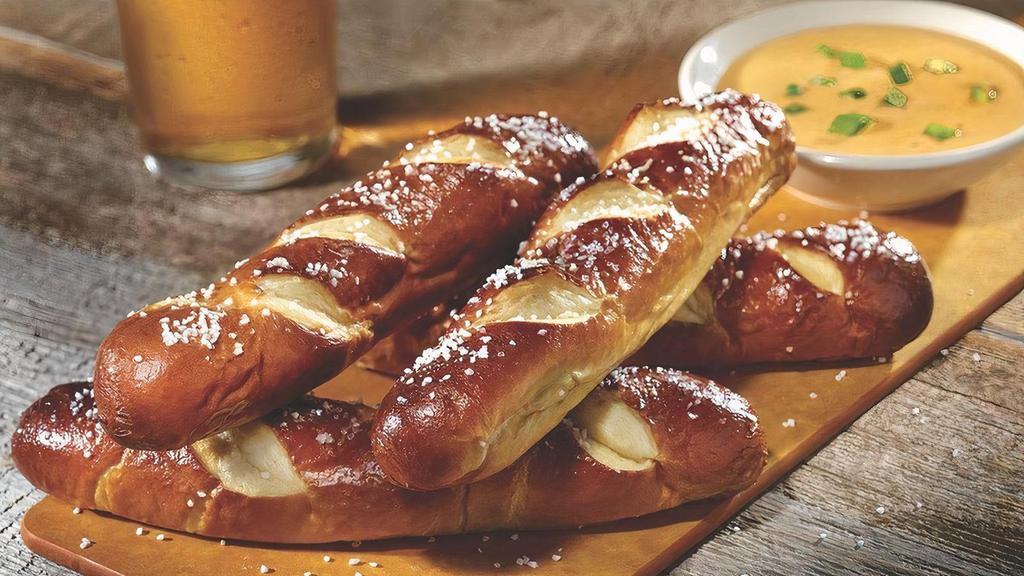 Bavarian Pretzel Sticks · Four Bavarian pretzel sticks served with mustard beer cheese sauce made with Guinness.