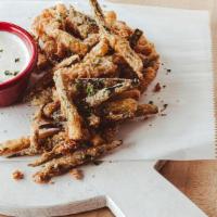 Fried Zucchini · Hand-battered fresh zucchini topped with parmesan seasoning blend. Served with ranch dressing.