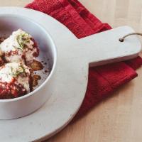 Meatballs · Three house-made meatballs in our signature red sauce topped with mozzarella, parmesan, and ...