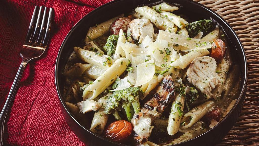 Chicken Pesto Alfredo · Penne Alfredo with applewood chicken, broccoli, , blistered tomatoes, pesto and shaved parmesan.