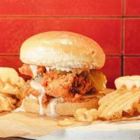 Nashville Hot Twisted Tender Sandwich · Nashville Hot crispy chicken tenders with pickles and ranch.