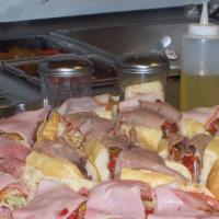 Large Party Tray · (combination of italian, turkey & ham subs feeds 12-14 people).