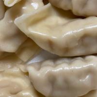 Steamed Dumpling · Ten pieces. . Steamed Chicken Dumplings wrapped with a soft wheat flour skin served with dum...