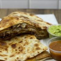 Quesadillas · Large flour tortilla filled with cheese, refried beans, poblano peppers and served with thre...