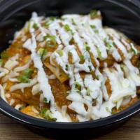 Chilaquiles Quesadillas · Oaxaca stuffed tortillas, pan-fried and tossed in salsa.