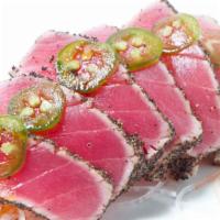 Tuna Tataki · Thin slices of peppered seared tuna with garlic ponzu sauce.